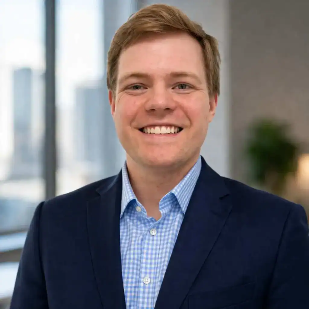 Justin Rice, attorney at Moran Law, smiling in a modern office